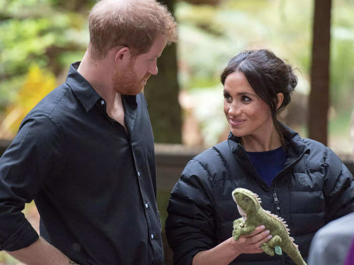 On the last day of this royal tour, Markle teased Harry with a stuffed animal while wearing what appeared to be his coat.