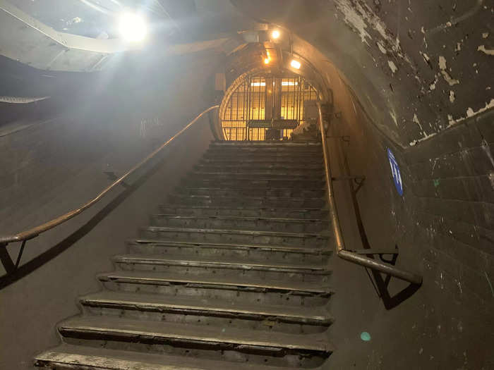 But inside, there are steps that lead down to abandoned corridors, walkways, and lift shafts, which would have been used when Piccadilly Circus station was first built.