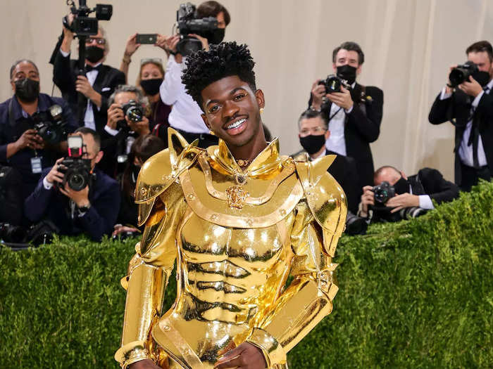 He took off his gold cape at the 2021 Met Gala to reveal a gold bodysuit that looked like a robotic suit of armor.