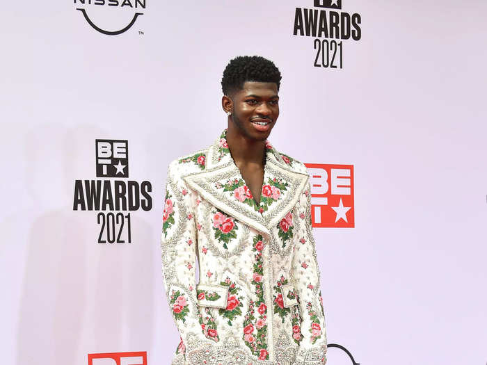Later the same evening, Lil Nas X changed into an embellished suit with florals and flares.