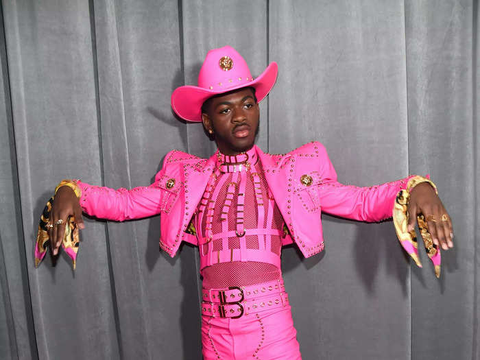 The singer continued his commitment to monochrome in a pink cowboy outfit for the 2020 Grammy Awards.