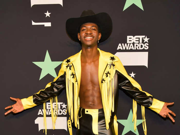 At the 2019 BET Awards, Lil Nas X opted for a black-and-yellow take on his signature cowboy outfit.