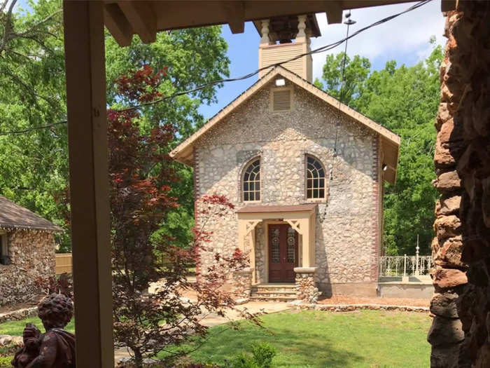 The completed chapel stands at the back of the castle, with an outdoor patio that overlooks the neighboring Tahlequah Creek.