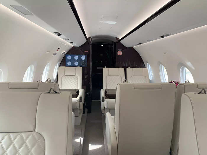 Inside the main cabin of the model I boarded, there were ten leather seats with added tables, charging plugs, and drink holders. The cabins are customizable and can be reconfigured in any way, according to Gulfstream.