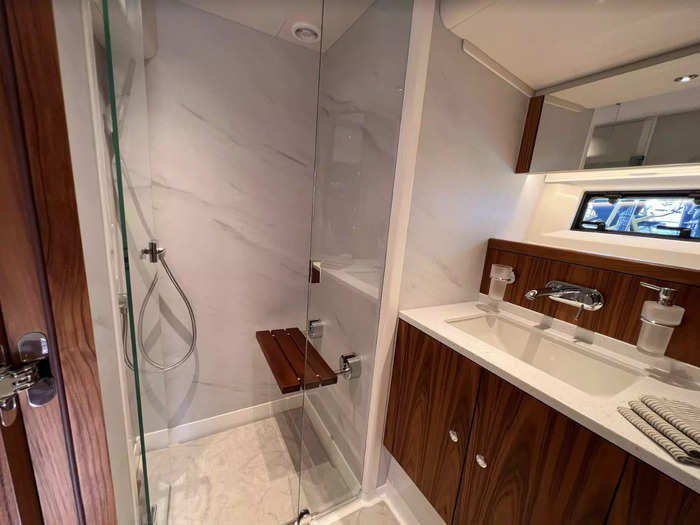 The bathroom, in the ensuite master bedroom, is roomy and has even a bench in the shower.