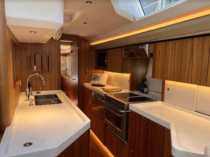 The galley has all the features you would expect in a modern kitchen, and the space is smartly configured with bins incorporated into the worktop.