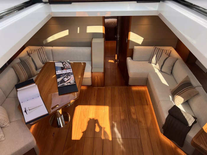 As you take the stairs from the main deck to the lower deck, you arrive in the lounge area where there are plenty of spaces to sit.