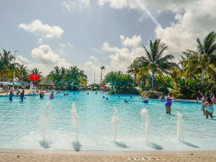 The pool features several inviting coves, upbeat music, and, of course, a swim-up bar.