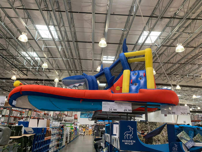 They carry much of the same merchandise, like this inflatable outdoor shark slide that was on display in both locations.