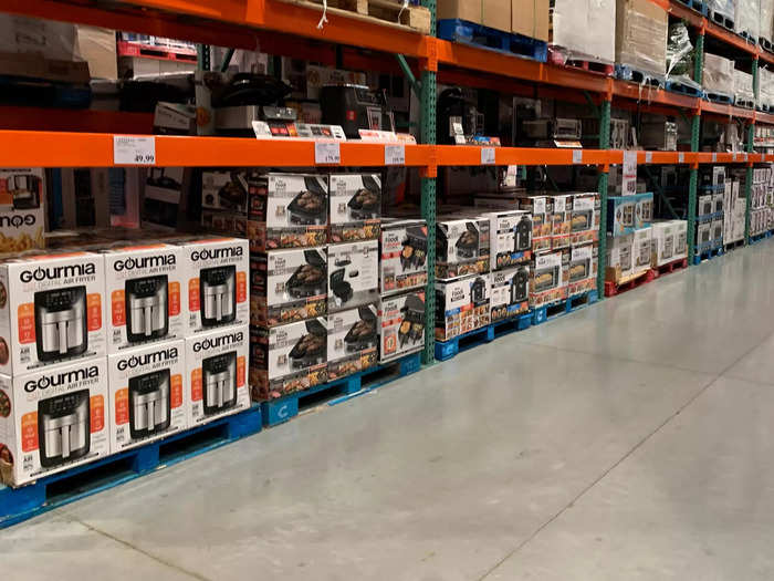 Ceilings are extremely high, and stocks of products extend nearly all the way up. Many of the largest products at Costco are located along this side wall.