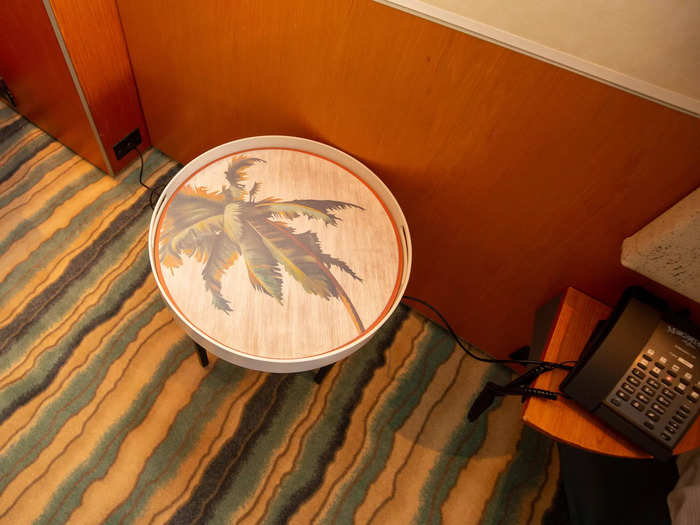 … a nightstand with a palm tree graphic …