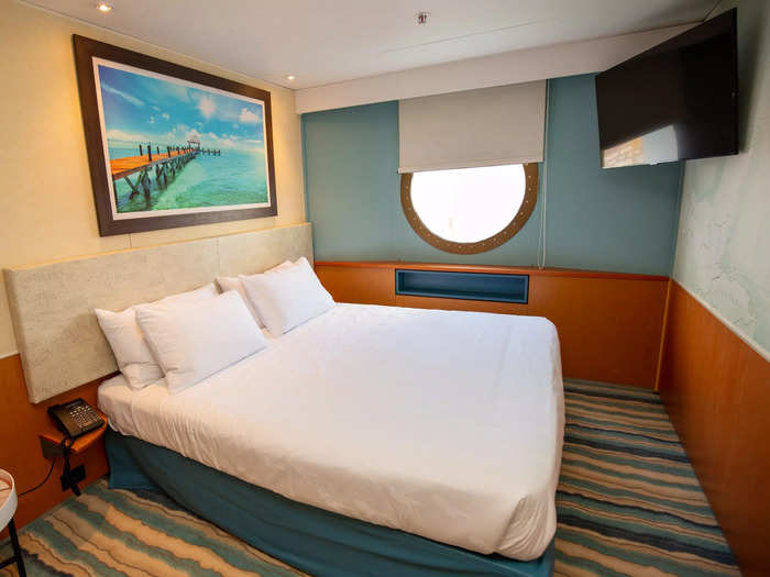 And the wood-colored accents aged the rest of my stateroom. Here, the only references to Margaritaville were in the four pieces of tropical wall art …