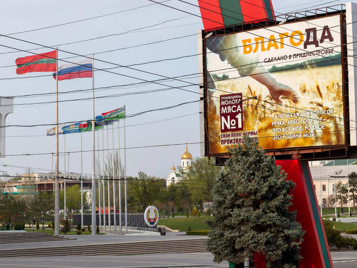 Russian and Transnistrian flags wave in Suvorov Square in Tiraspol, the self-proclaimed capital.