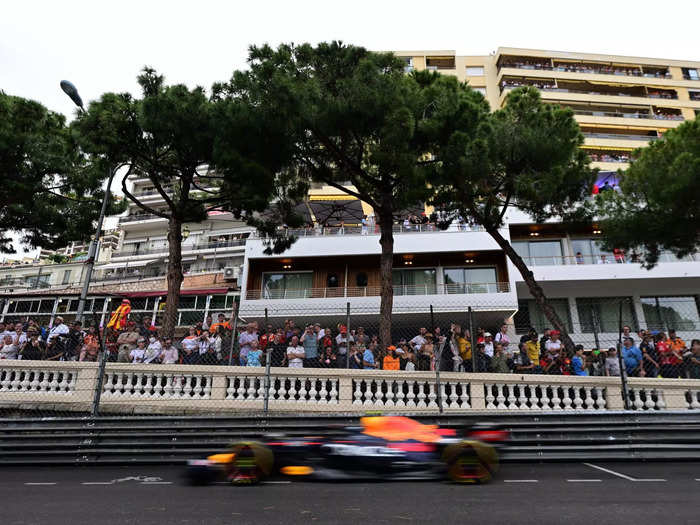 Sergio Perez races past the fans.