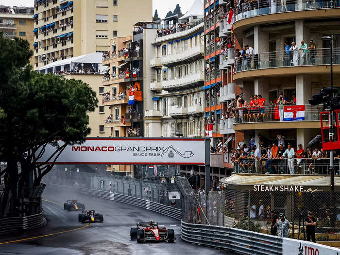 Fans watch from balconies above the track.