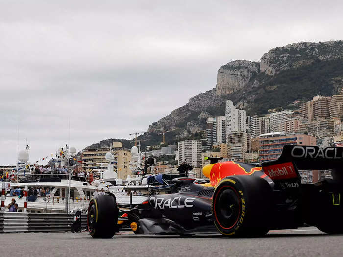 Max Verstappen races in the shadow of the mountain.