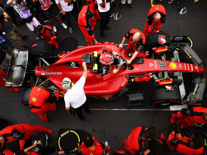 Charles Leclerc climbs into his car before the race. He started on pole, but a failed pit strategy dropped him to fourth.