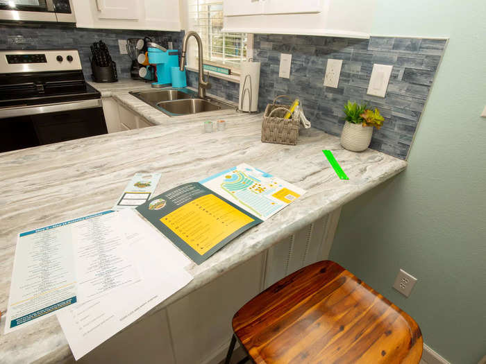 The cabin has no dining table apart from the kitchen island seats.