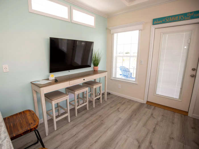 The door between the television and couch leads into the back deck …