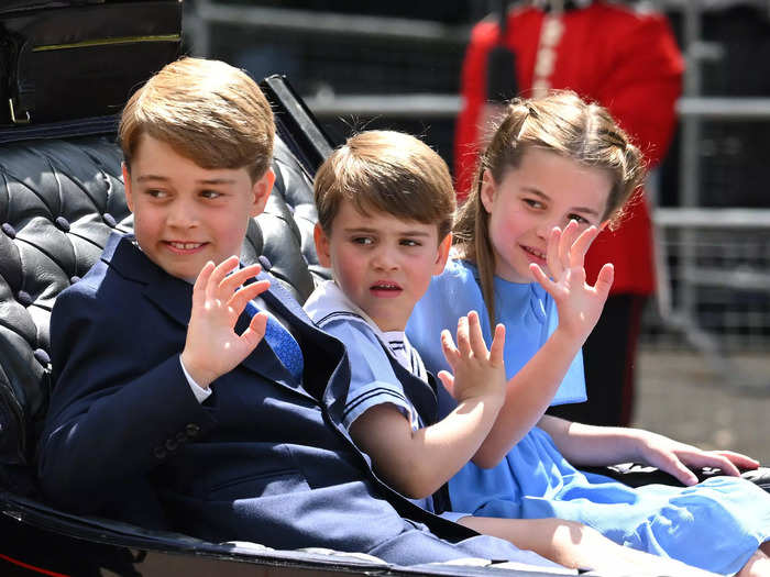 The young princes and princess showcased their best royal waves to the thousands of fans lining the streets of central London.