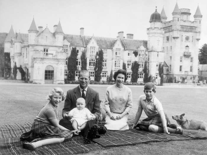 Though casual portraits of the royal family are rare, this snap of Queen Elizabeth picnicking at Balmoral Castle in Scotland is one of the most iconic royal family photos.