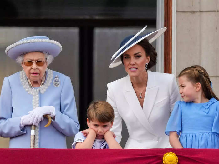 Middleton continued to talk to her son as he put his hands in fists and frowned as he leaned on the balcony.