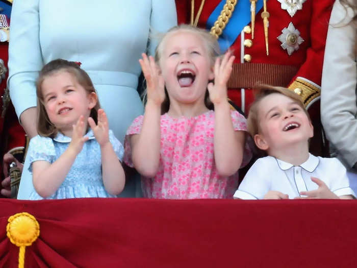 But later, Savannah, Charlotte, and George all grinned and clapped as they watched the parade.