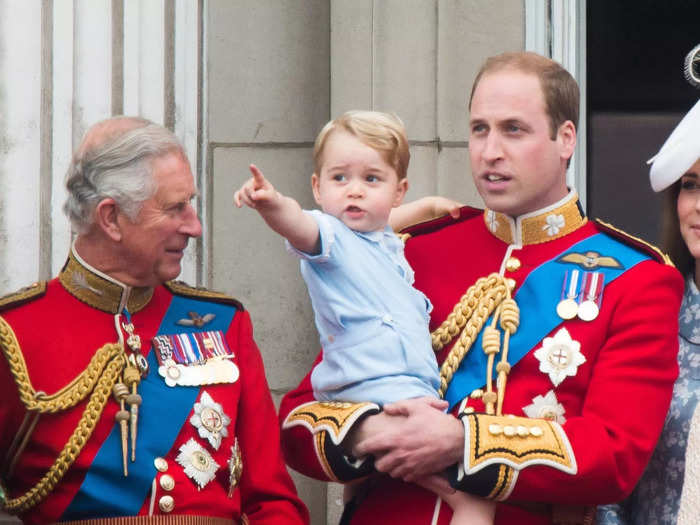 When he did reach the balcony, photographers captured the young prince pointing at the crowds as his father and uncle did years before him.