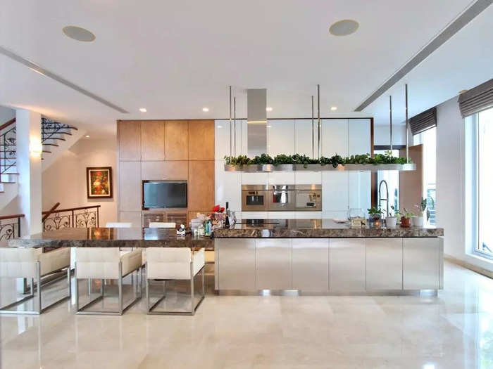 The indoor kitchen features a sleek open-concept design.