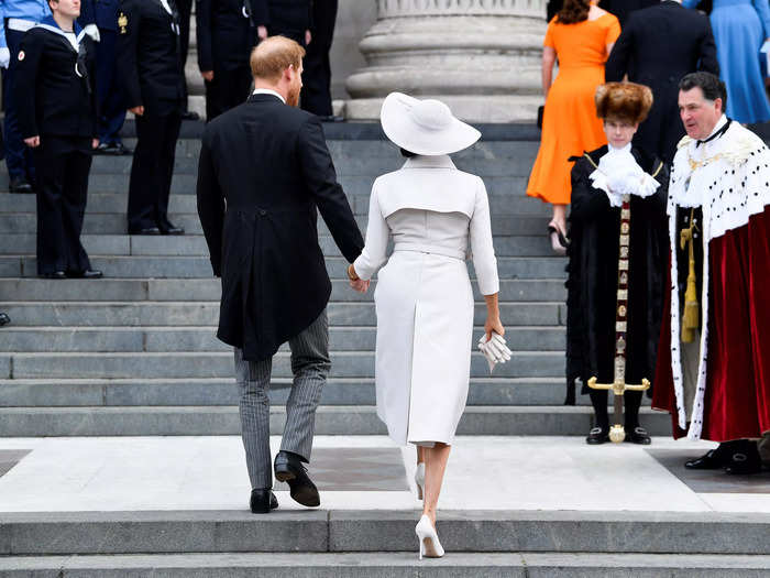 Harry and Markle walked up the steps of the cathedral as clergy members waited to greet them.