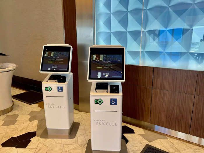 There are four kiosks available for self-check-in before riding the escalator or elevator up to the lounge.