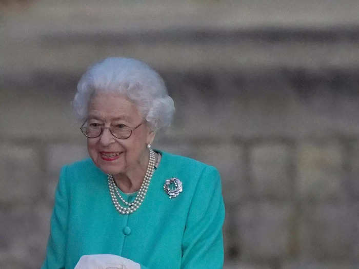 Later that night, she helped light a beacon ceremony in an aquamarine look and special Platinum Jubilee brooch.