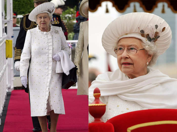 The Queen wore a glittering white coat and an extravagant hat for a river procession on June 3, 2012.
