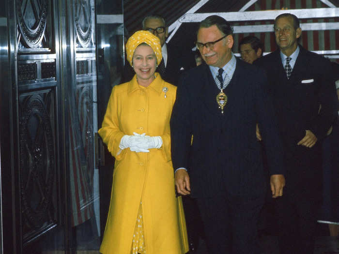 She wore a striking yellow coat and turban for the River Thames Pageant on June 9, 1977.