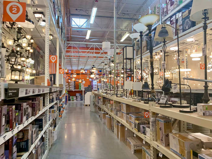 Home Depot is a huge warehouse store with dozens of aisles stacked to the ceiling with home improvement supplies.