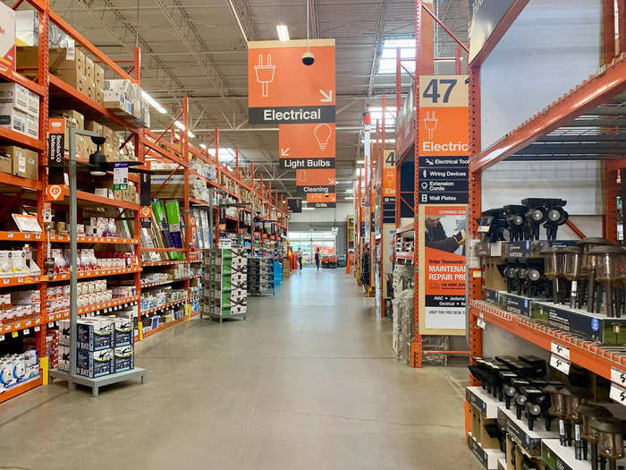 Home Depot is a huge warehouse store with dozens of aisles stacked to the ceiling with home improvement supplies.