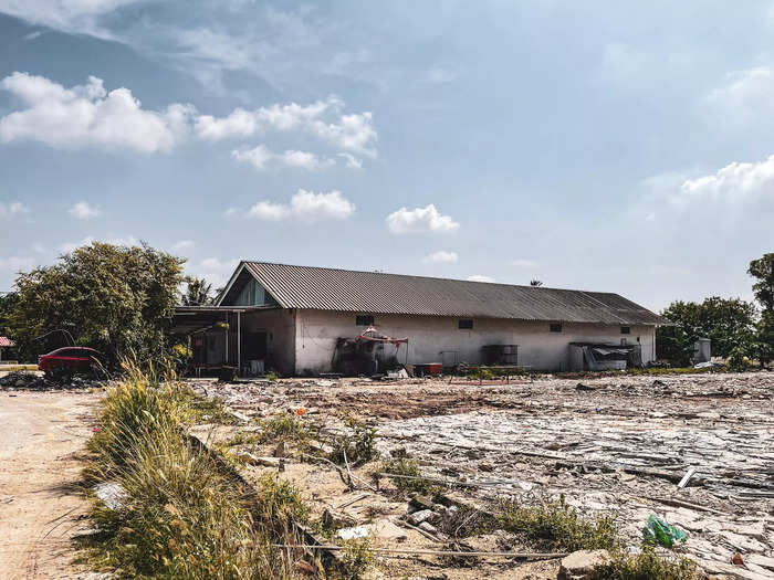 On a road that leads back to mainland Johor Bahru, I found a shed surrounded by debris. Forest City housed its construction workers on sites similar to this one, several locals told me. The development