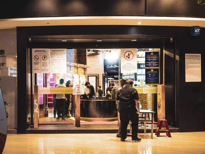 Finally, I spotted the duty-free shop — and, just as the couple on the beach had said, it was indeed full of people. It was the busiest spot in the entire development.