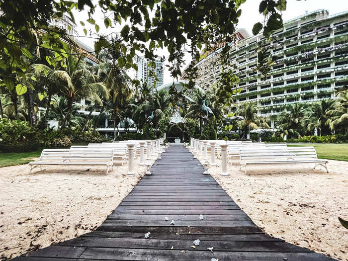 As I headed for the beach, I found an open-air wedding venue. The trellis was decorated with fresh flowers, striking a stark contract with the tarnished benches and pillars.