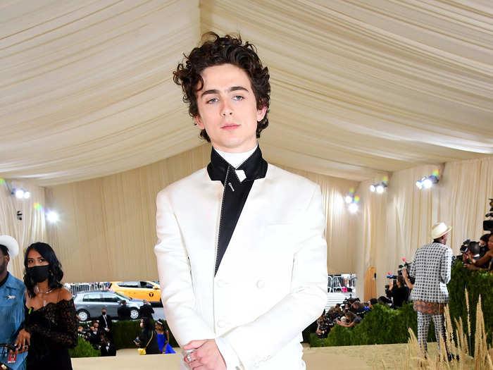 To co-chair the 2021 Met Gala, Chalamet wore an asymmetrical white tuxedo jacket, white sweatpants, and Converse.