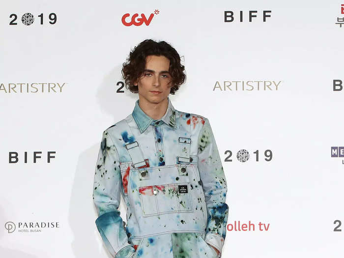 Chalamet traveled around the globe to attend a screening of his film "The King" at the Busan International Film Festival in South Korea a few days later. He wore a pair of paint-splattered overalls, a matching denim shirt, and giant white boots.