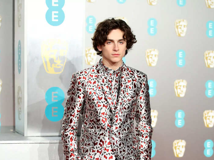 He mixed prints at the 2019 BAFTA Awards in February in a silver printed jacket, matching shirt, and black pants with a red checkerboard design on the leg.