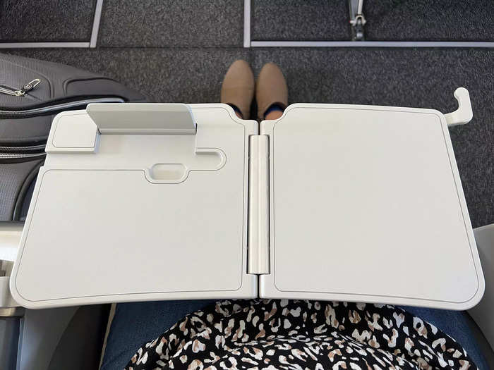 The exit row had a tray table in the armrest, which is where the phone stand was.