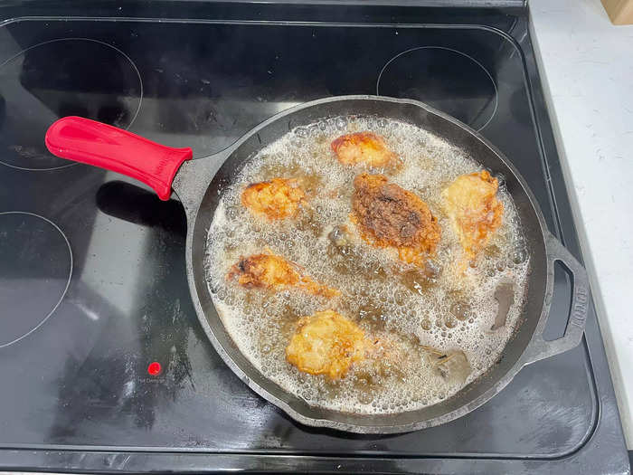 Add the cooled chicken back into the fryer for around one minute.