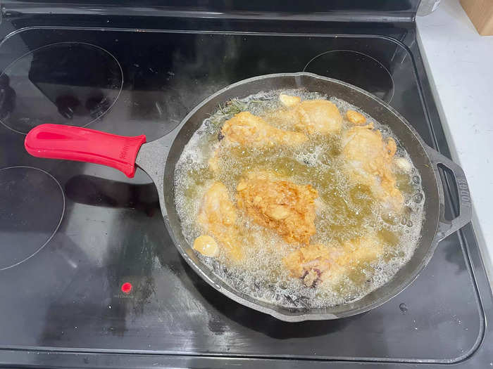 Add the chicken to the heated oil and let it fry for around seven minutes.