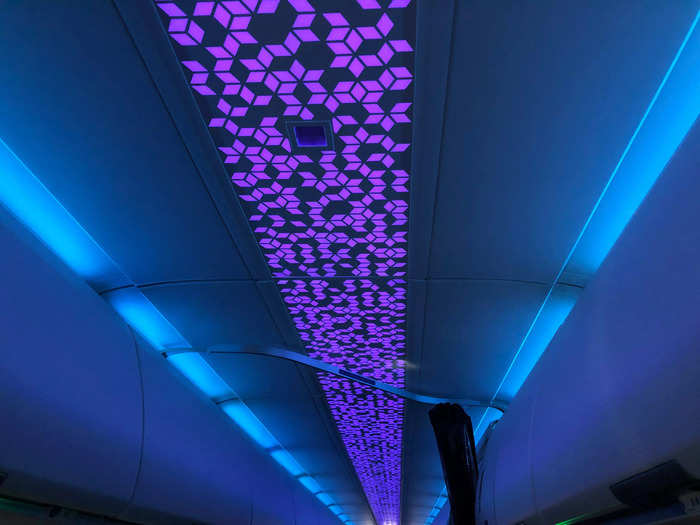 The lighting above the overhead bins draws your eyes upward and makes the ceilings appear taller somehow.