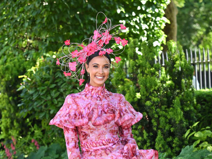 British radio presenter and TV personality Maya Jama stunned in a frilled, silk linen dress from Zimmerman, paired with a pink floral headpiece.