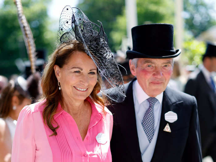 Michael and Carole Middleton, who opted for a dress previously worn by her daughter Kate in 2021, also attended day one of the races.