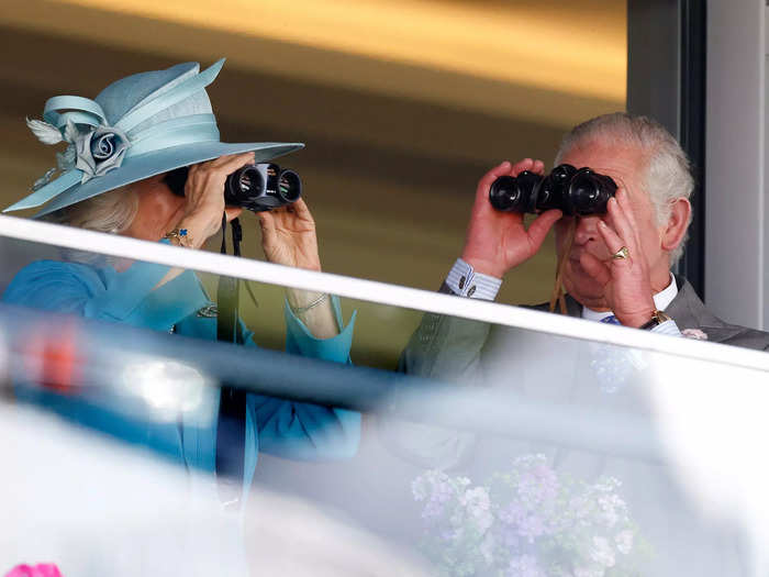 Prince Charles and Camilla were invested in the race on Tuesday, using binoculars to get a closer look.