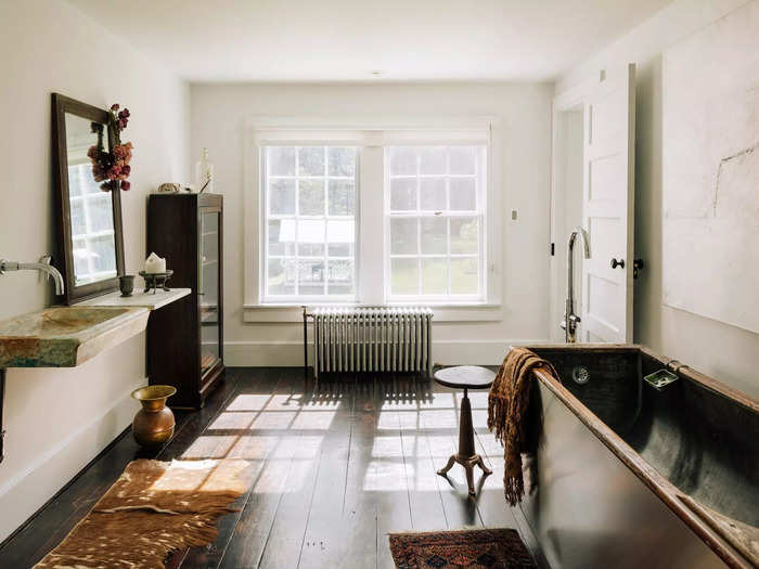 The house comes with two full bathrooms, one of which is outfitted with antique sanitary wares — including an 18th-century sink and a 19th-century bathtub.